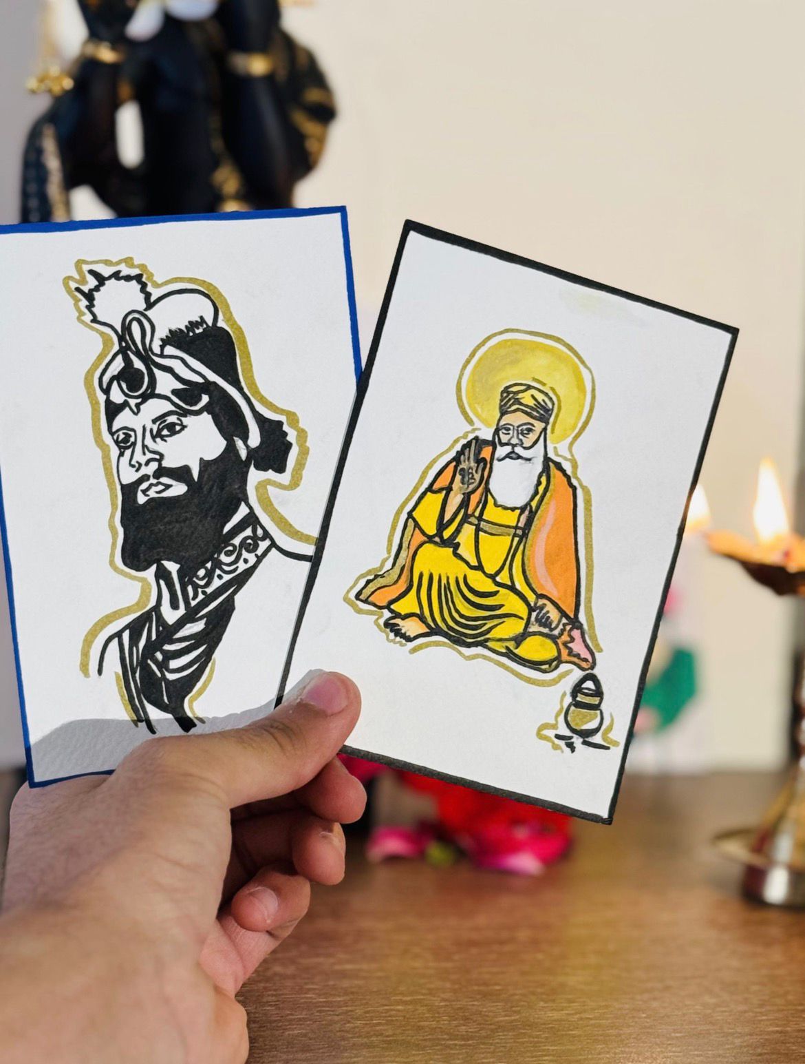 Hand-held devotional cards with diya